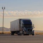 black truck on road during daytime