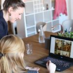 girl using black laptop computer